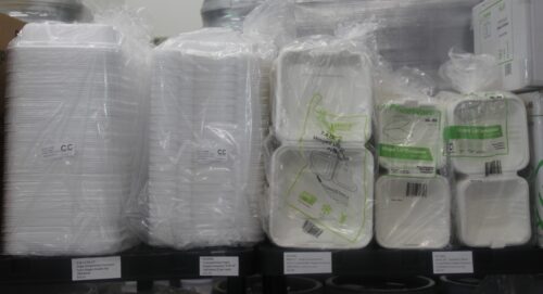 photo of five stacks of take out containers in various sizes on a shelf at C&C Suppliers