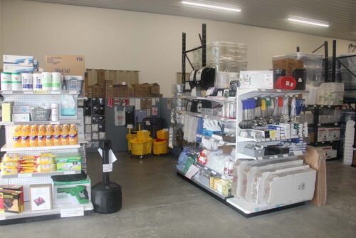 Photo of C&C Suppliers warehouse shelves filled with cleaning supplies and kitchen supplies