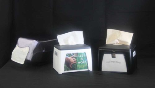 photo of 3 napkin dispensers sold by C&C Suppliers, one white with gray and one black, both with a display panel for customization, arranged on a black background
