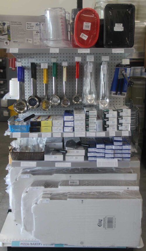 Catering supplies and kitchen utensils stocked on a shelf at C&C Suppliers